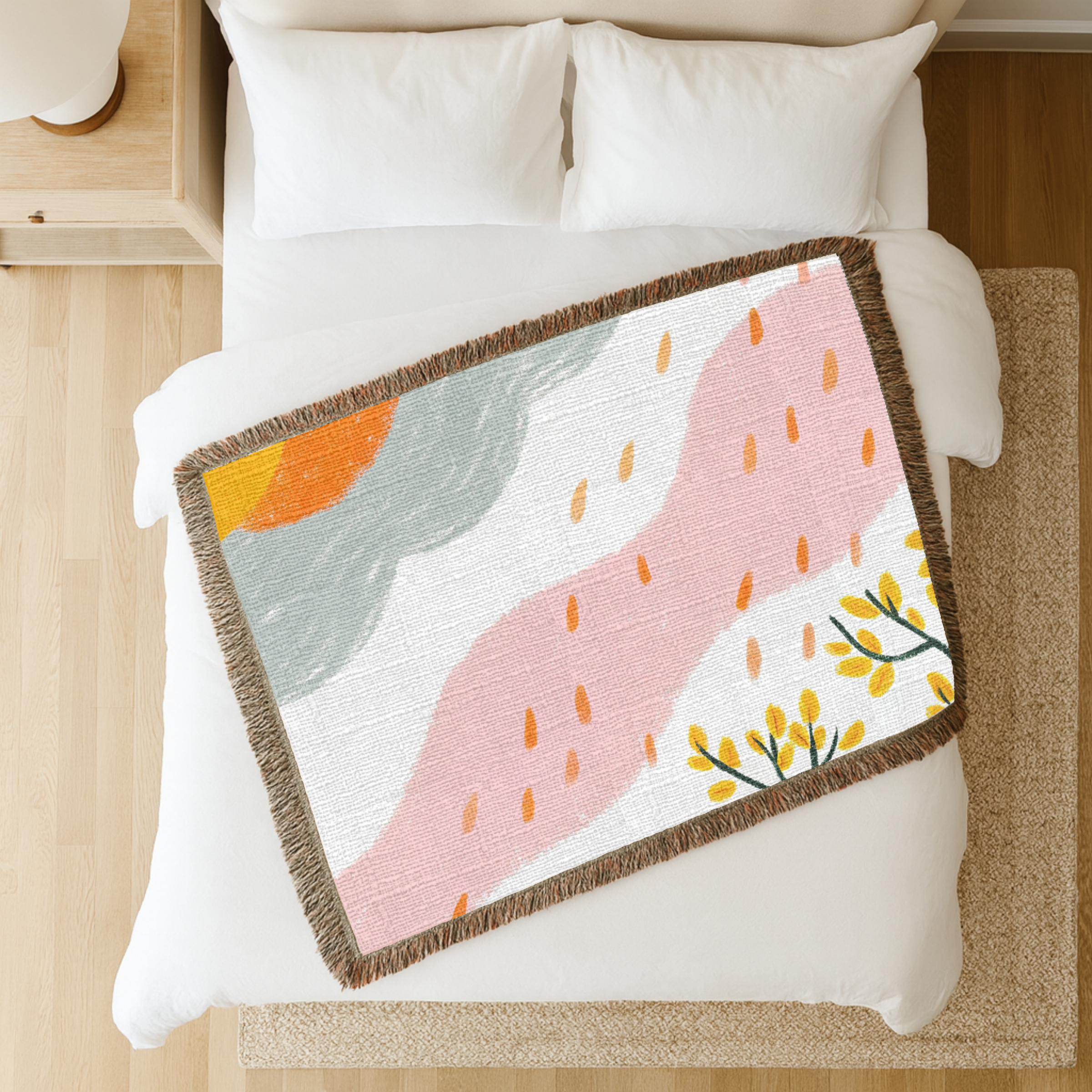 Blanket with hand-drawn photo laying across a bed.