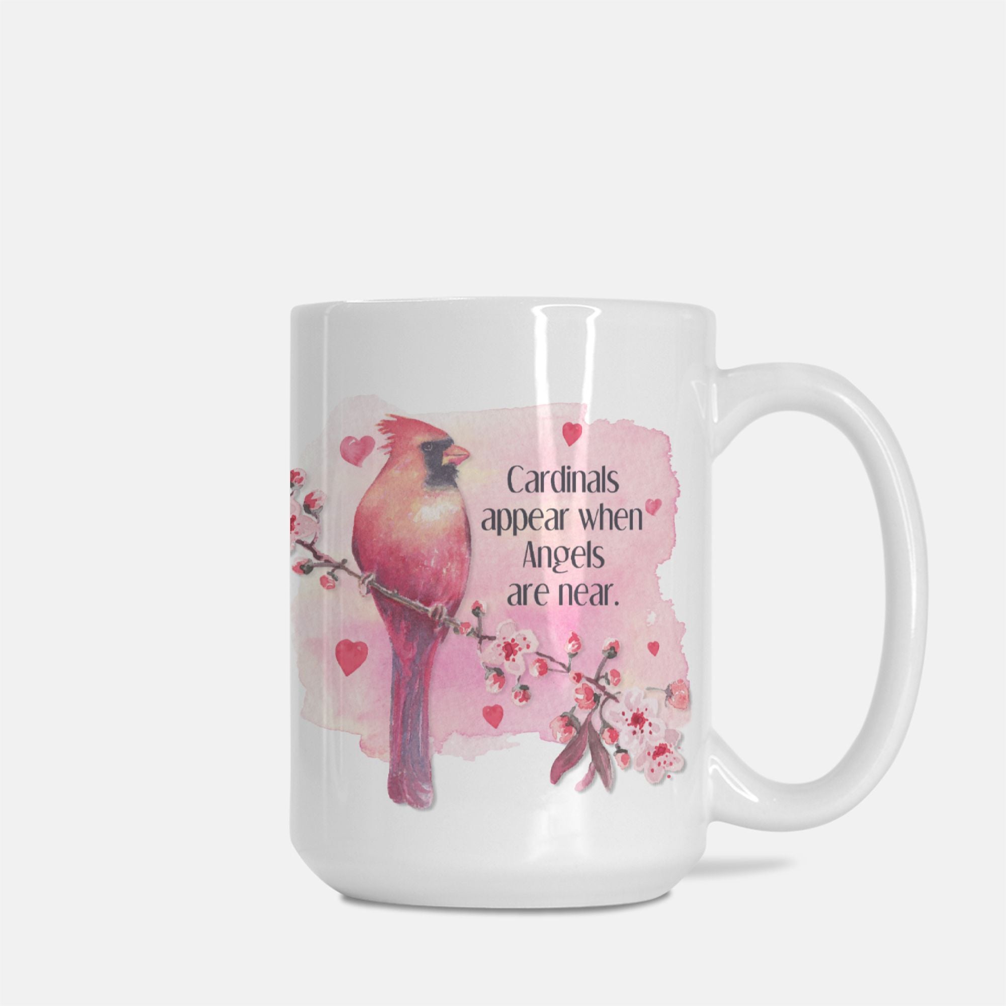 White mug with a pink cardinal design and text on a white background
