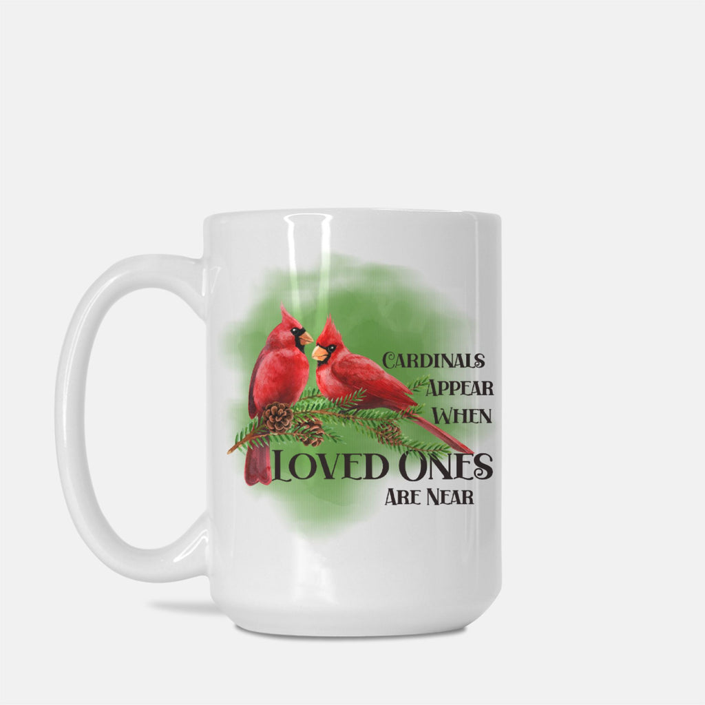 White mug with red cardinals and text on a white background