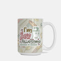 Mug with 'I'm Sew Awesome' text and sewing-themed design on a light background