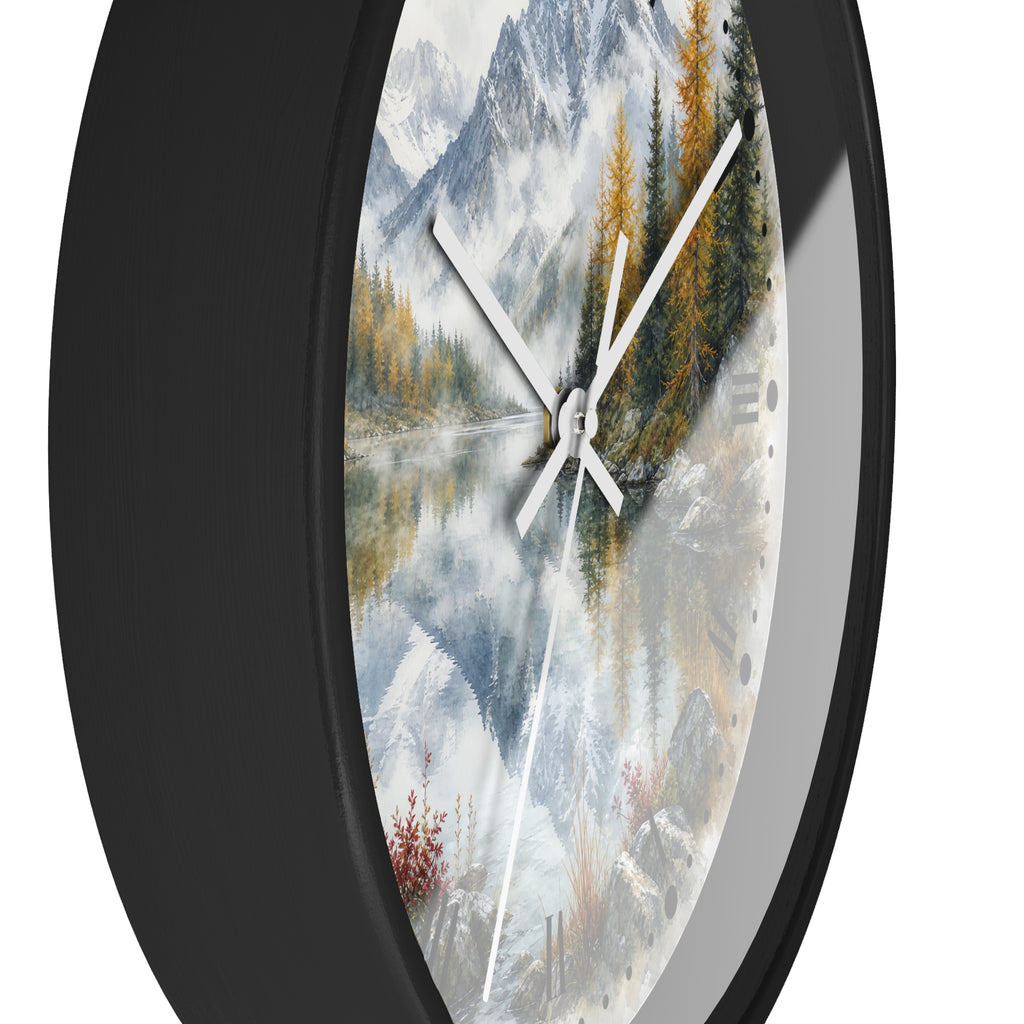 Round wall clock with a black frame and a scenic landscape print featuring snowy mountains, pine trees, and a reflective lake, shown against a white background.