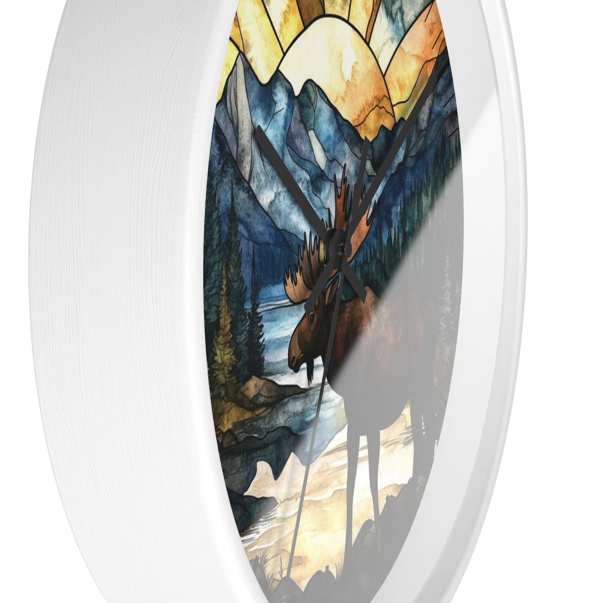 Oval wall clock with a white frame and a stained-glass-style nature print featuring a moose, mountains, trees, and a river.
