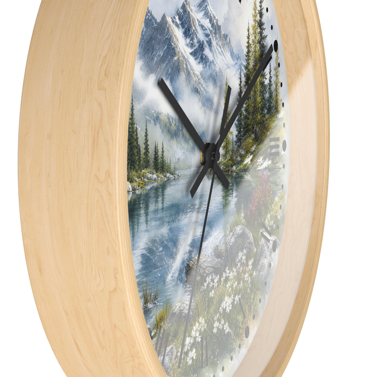 Round wall clock with a light natural wood frame and a scenic landscape print featuring a mountain lake, pine trees, and wildflowers, with black hands.