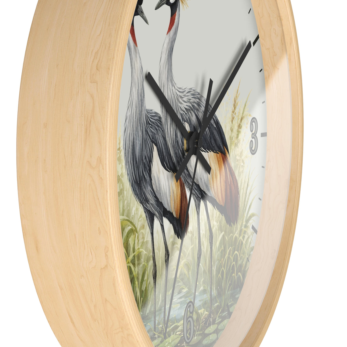 Round wall clock with a light natural wood frame and a printed bird illustration on the face, shown against a plain white background.