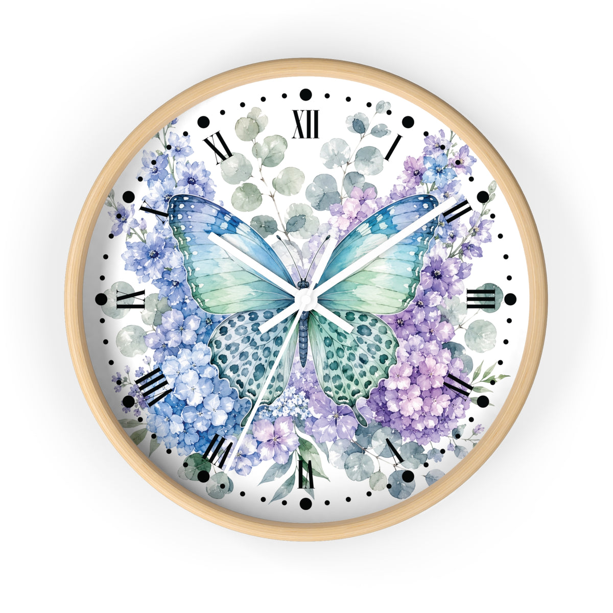 A round wall clock with a light wood frame and a white face featuring a watercolor-style blue and purple butterfly surrounded by hydrangea flowers and green leaves, with black Roman numerals and markers.