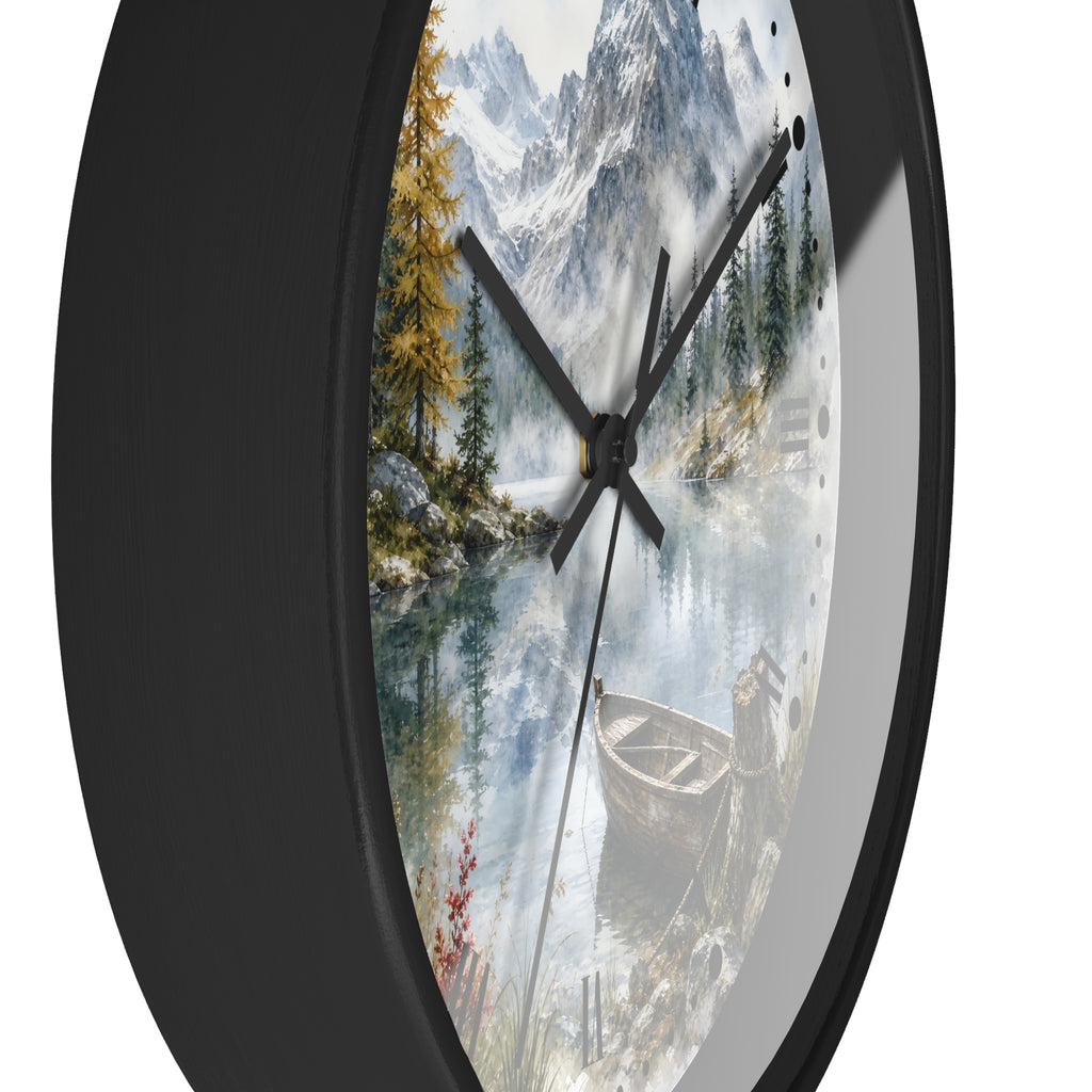Round wall clock with a black frame and a scenic mountain lake print on the face, featuring pine trees, a boat, and white mountain peaks.