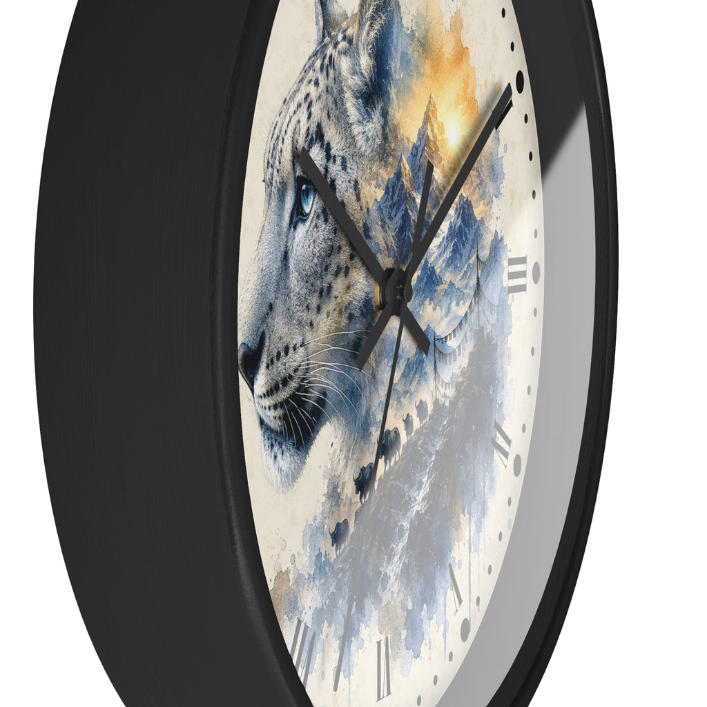 A close-up of a round wall clock with a black frame and a printed face featuring a stylized snow leopard in blue, gray, white, and warm golden tones over a mountain-like background.