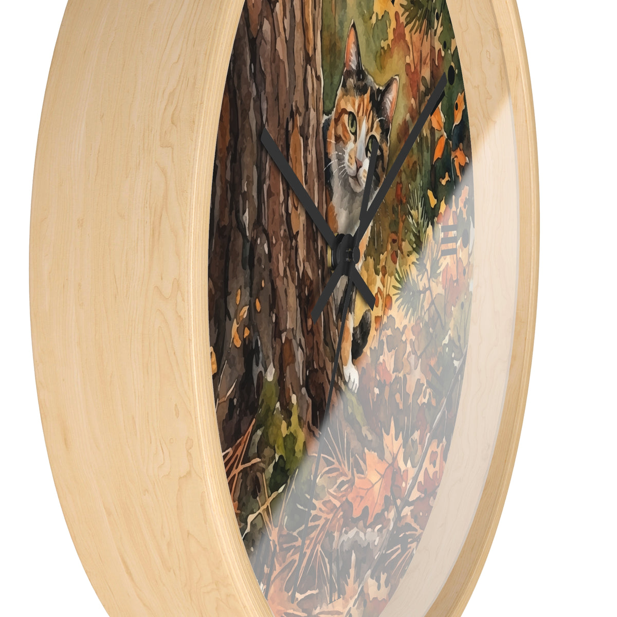Round wall clock with a light natural wood frame and a printed scenic face showing a calico cat behind a tree in an autumn forest.