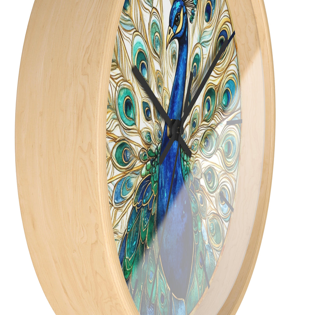 Round wall clock with a light natural wood frame and a printed peacock artwork featuring blue, teal, green, and gold feather patterns on a white background.