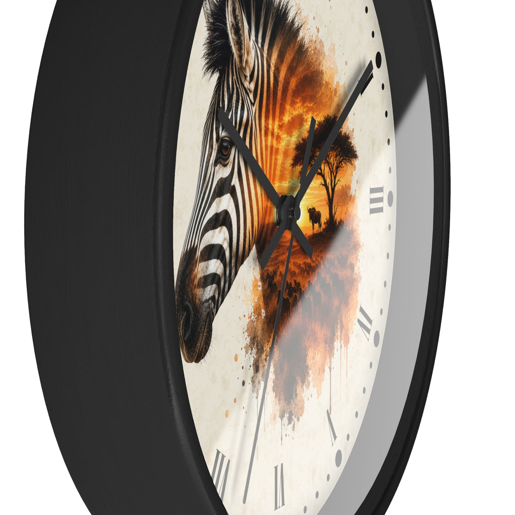 A round wall clock with a black frame and a white dial featuring a stylized zebra head over an orange sunset landscape illustration, shown on a plain white background.