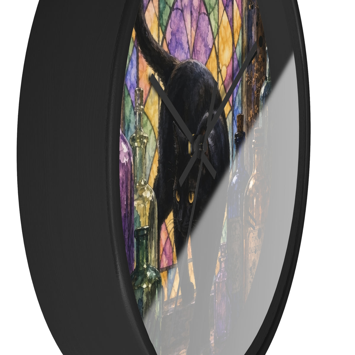 A round wall clock with a black frame and a printed design of a black cat in front of a colorful stained-glass-style background with purple, yellow, and orange panels.