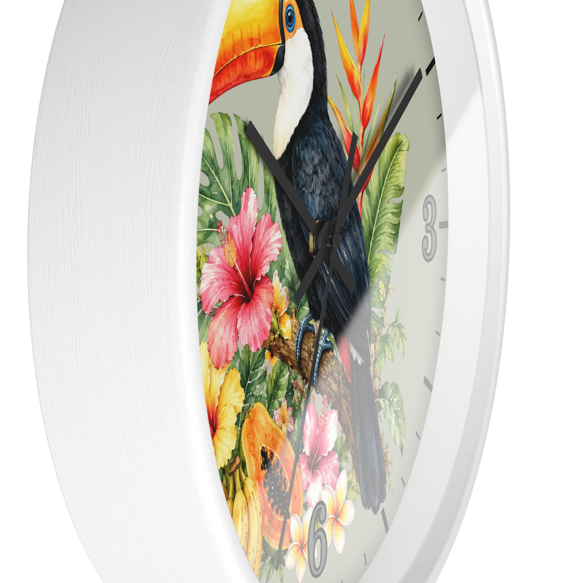 A white round wall clock featuring a colorful tropical design with a toucan, hibiscus flowers, and green leaves on the face.
