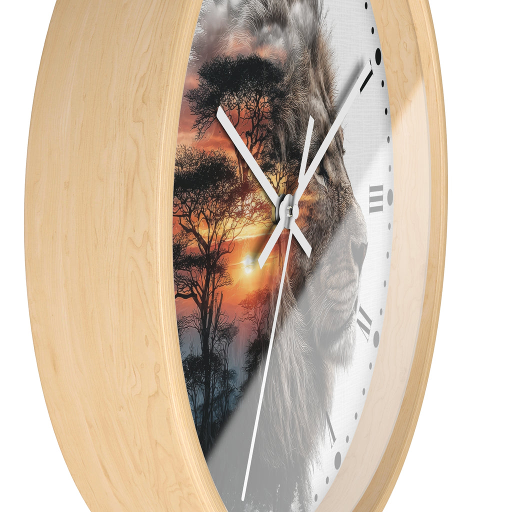 Round wall clock with a light natural wood frame and a split-face design showing a lion face on one side and an African savanna sunset with acacia trees on the other, featuring white hands and black Roman numerals.