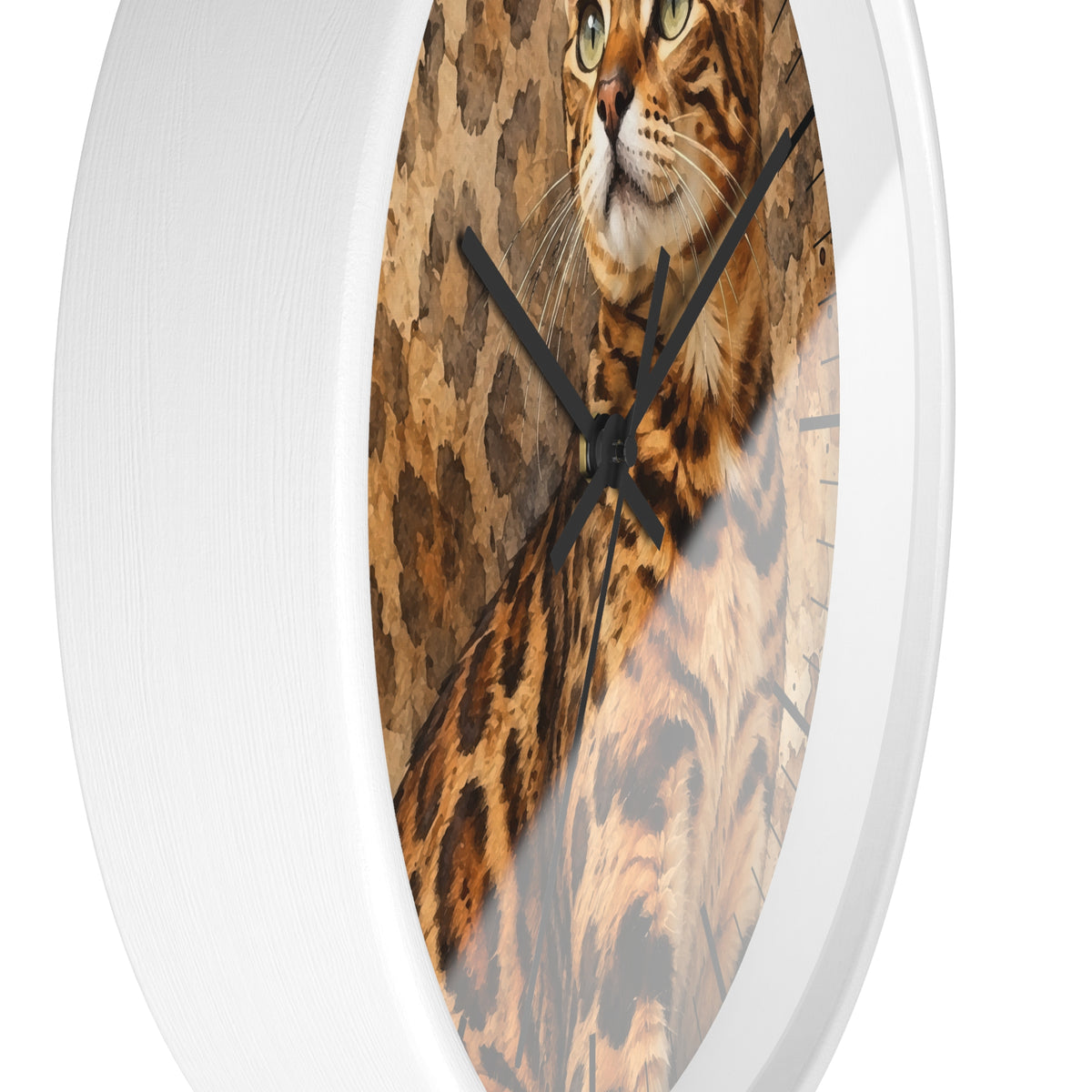 A round wall clock with a white frame and a printed face showing a close-up image of a spotted Bengal cat, against a tan and brown patterned background.