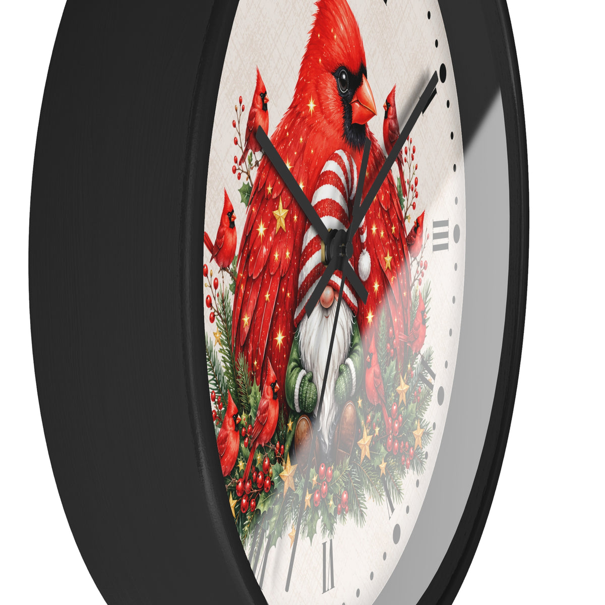 A close-up of a round wall clock with a black frame and a white face featuring a festive illustration of red cardinals, evergreen branches, berries, and holiday lights.