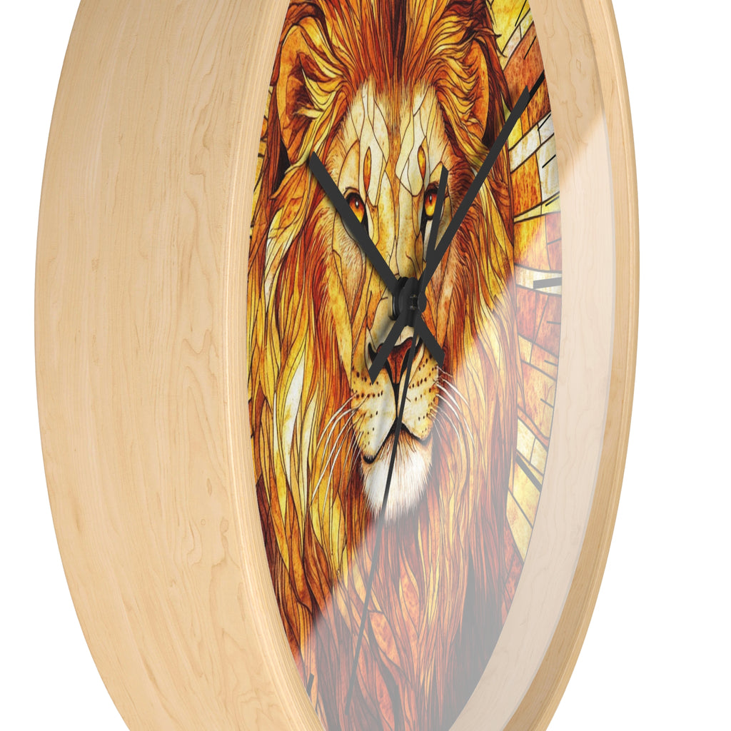 A round wall clock with a light natural wood frame and a printed lion face design on the face, featuring black clock hands.
