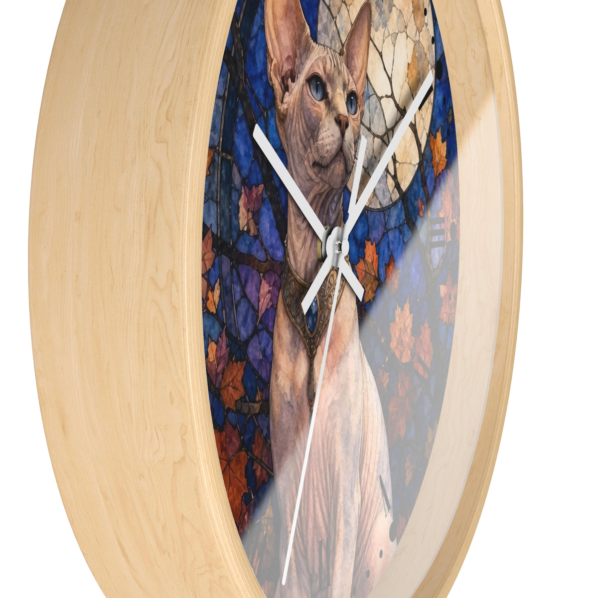 Round wall clock with a light natural wood frame and a printed center artwork of a Sphynx cat in front of a stained-glass-style background with blue, purple, orange, and cream tones.