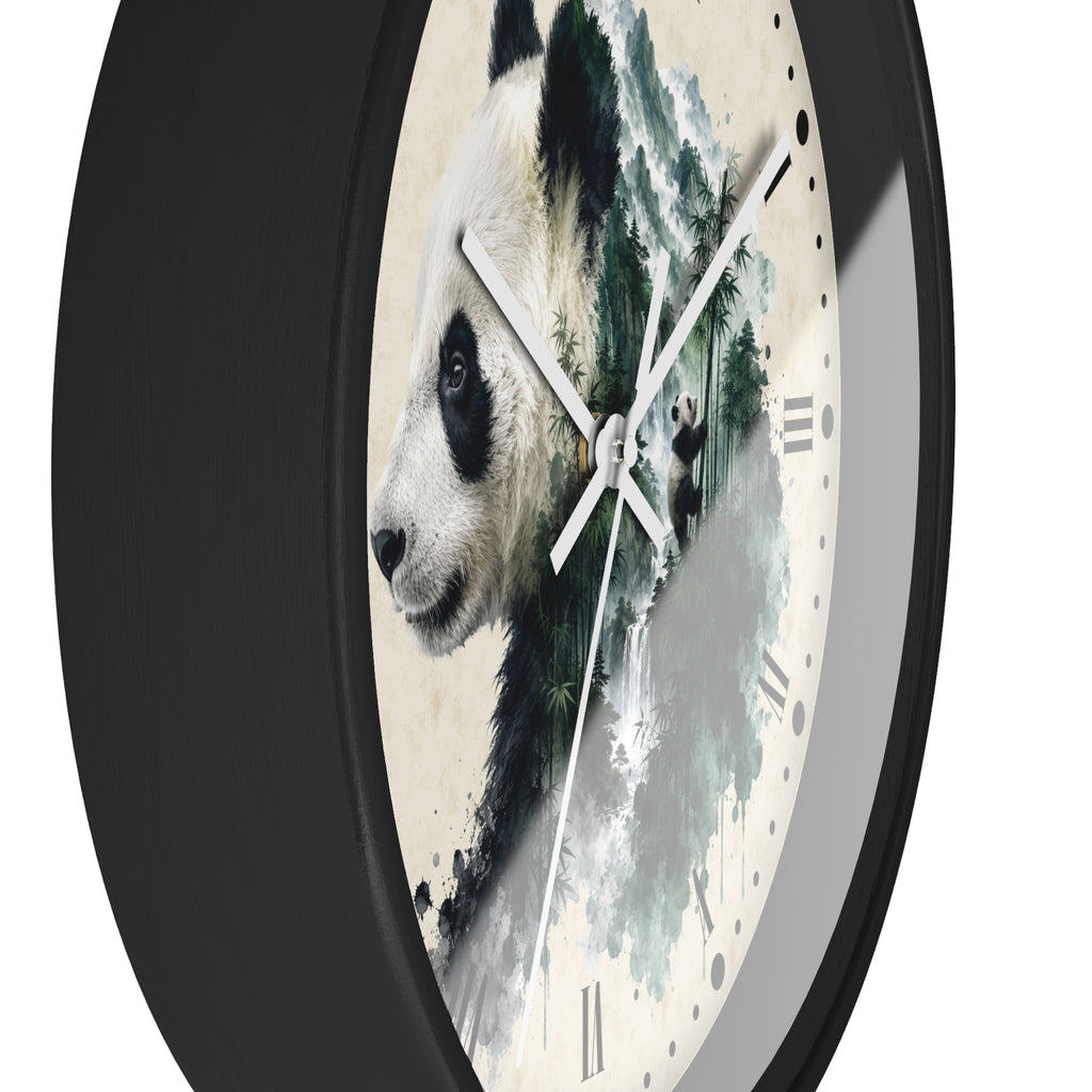 A round wall clock with a black frame and a cream-colored face featuring a painted panda illustration and green watercolor brushstrokes. The clock is shown at an angle against a plain white background.