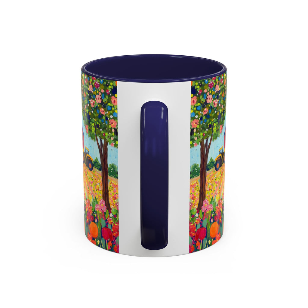 Colorful mug with floral design and navy handle on a white background