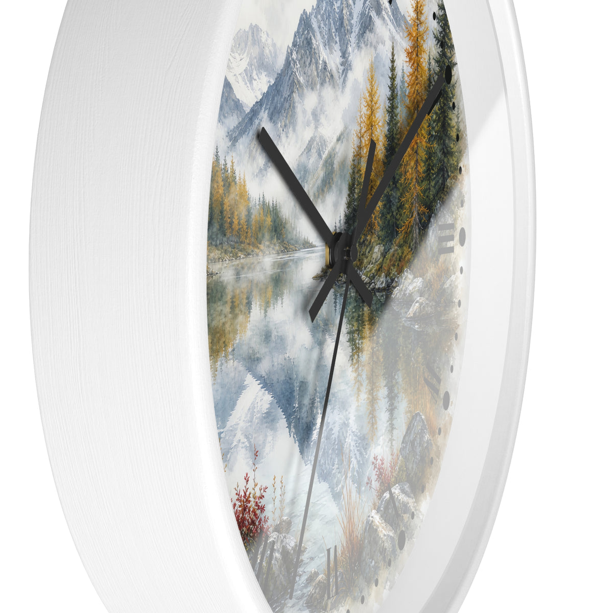 Round wall clock with a white frame and a scenic landscape print featuring snowy mountains, a reflective lake, evergreen trees, and dark clock hands.