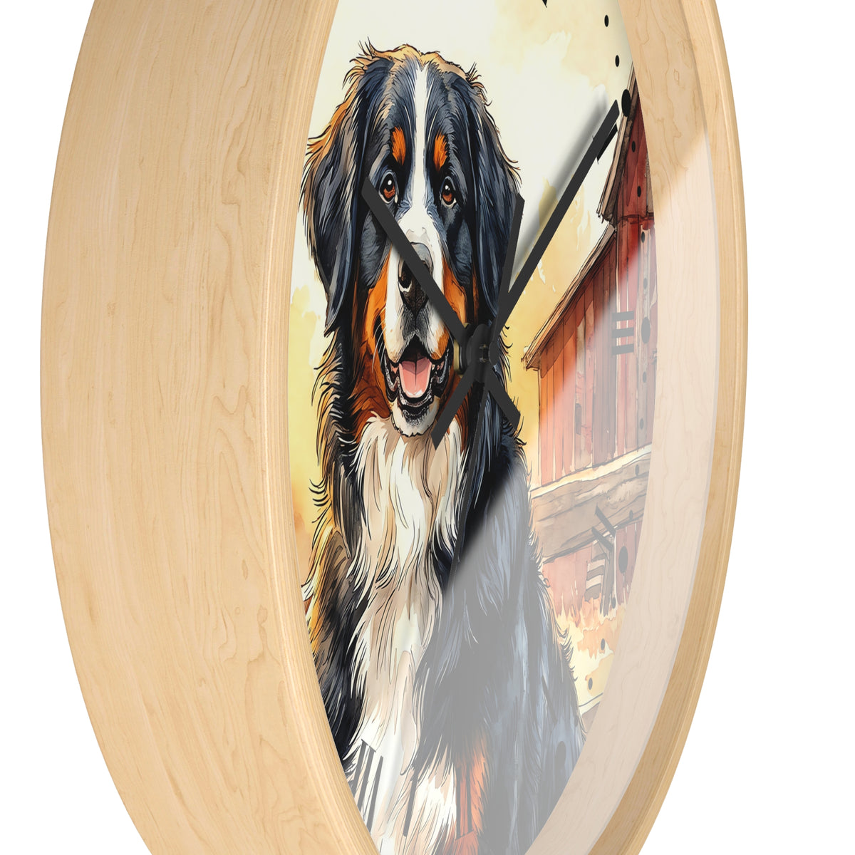 A round wall clock with a light natural wood frame and black hands, featuring a painted Bernese Mountain Dog portrait and a red barn scene on the face, shown against a plain white background.