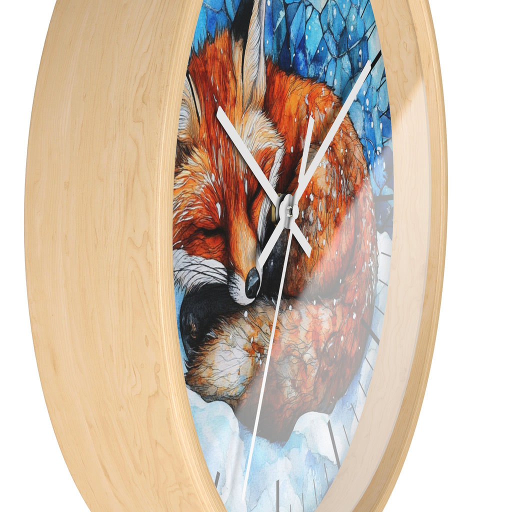 Round wall clock with a light natural wood frame and a printed artwork of a sleeping fox in blue and white tones on the face, shown against a plain white background.