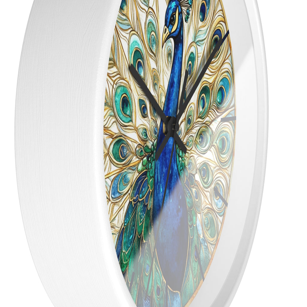 A round wall clock with a white frame and a printed peacock design featuring blue, teal, green, and gold feather patterns on a white background.