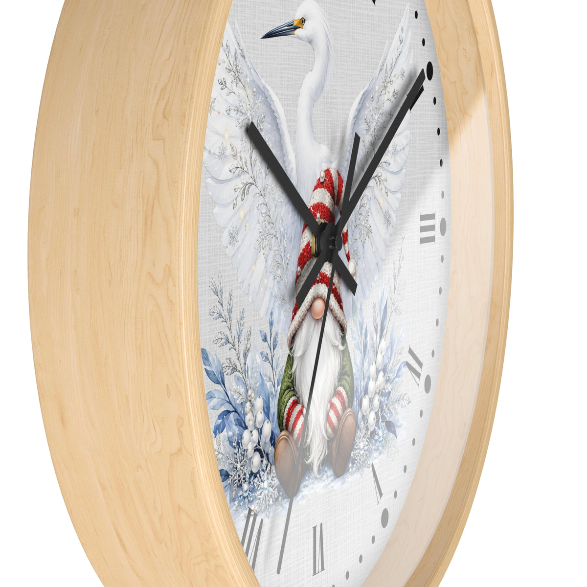 Round wall clock with a light natural wood frame and a white clock face featuring a winter scene with a white bird, blue snowflakes, and a gnome in red and green clothing.