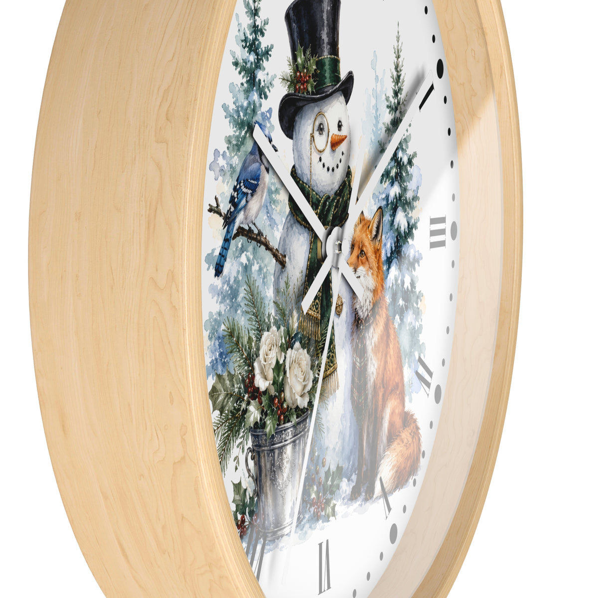 Round wall clock with a light natural wood frame and a white face featuring a winter illustration of a snowman in a top hat, a bluebird, a fox, evergreen trees, and a bucket of flowers.