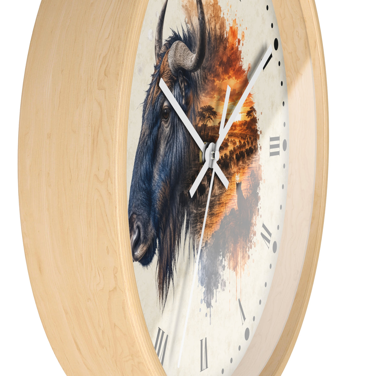 Round wall clock with a light natural wood frame and a printed face featuring a detailed blue wildebeest head blending into an orange sunset landscape, with white hands and black Roman numerals.