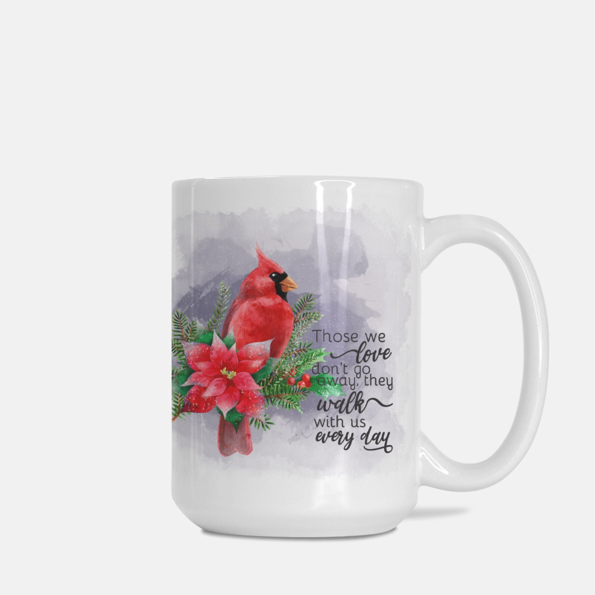 Mug with a cardinal and poinsettia design on a white background