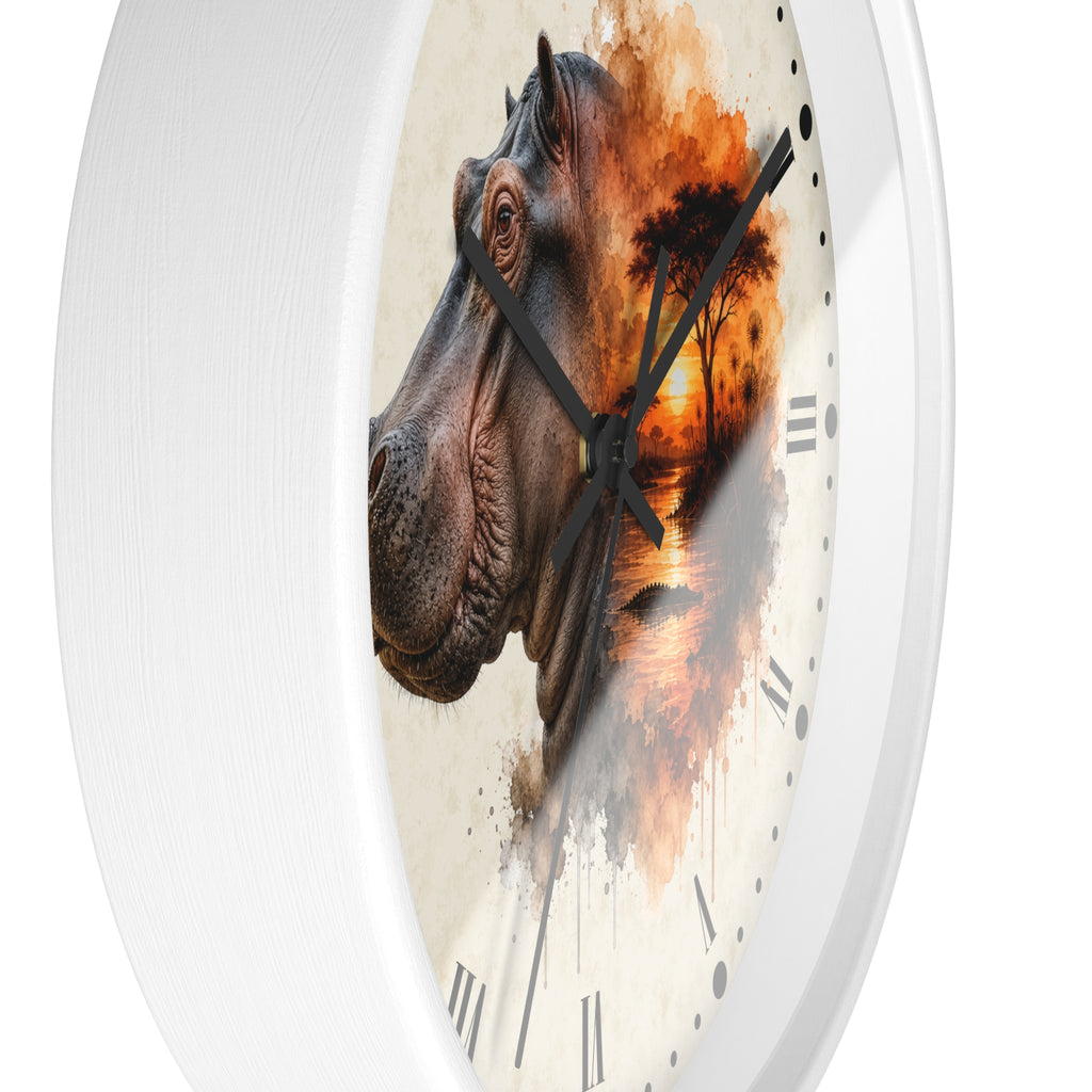 A round wall clock with a white frame and a printed design featuring a hippopotamus head merging into an orange sunset scene on a cream background.