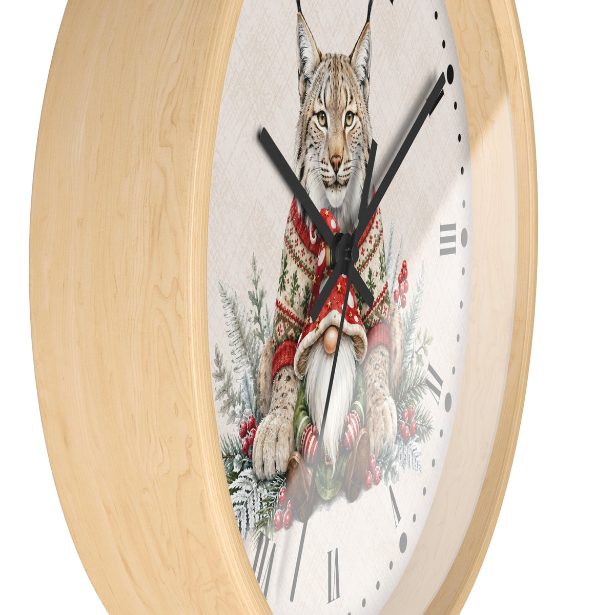 A round wall clock with a light natural wood frame and a white clock face featuring an illustration of a lynx wearing a red knit sweater, seated among holiday greenery and ornaments.