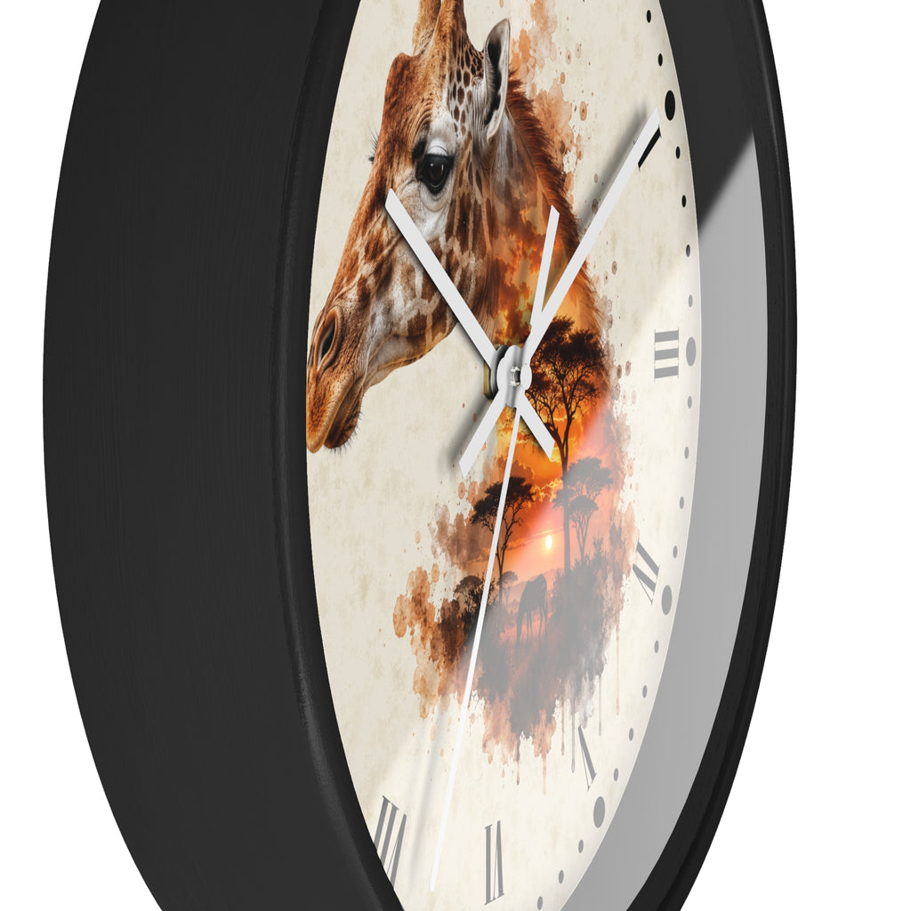 A round wall clock with a black frame and a cream-colored face featuring a painted giraffe head and an orange-toned savanna sunset scene. White clock hands and simple black Roman numerals are visible.