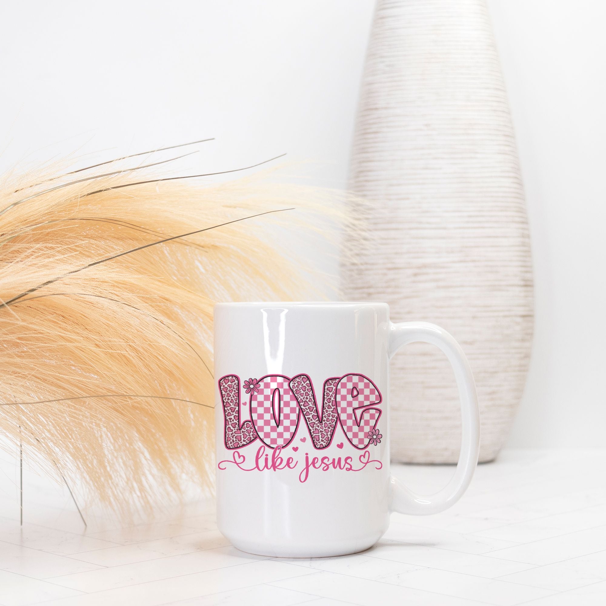 White mug with 'Love like Jesus' text on a white background