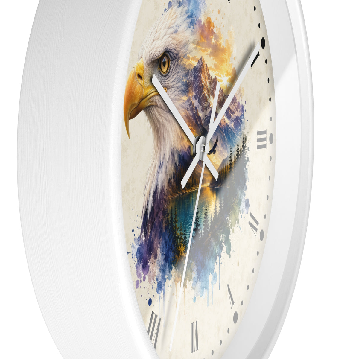 A white round wall clock featuring a watercolor-style print of an eagle's head with blue, purple, yellow, and orange brushstrokes on the dial, with white hands and black Roman numerals.
