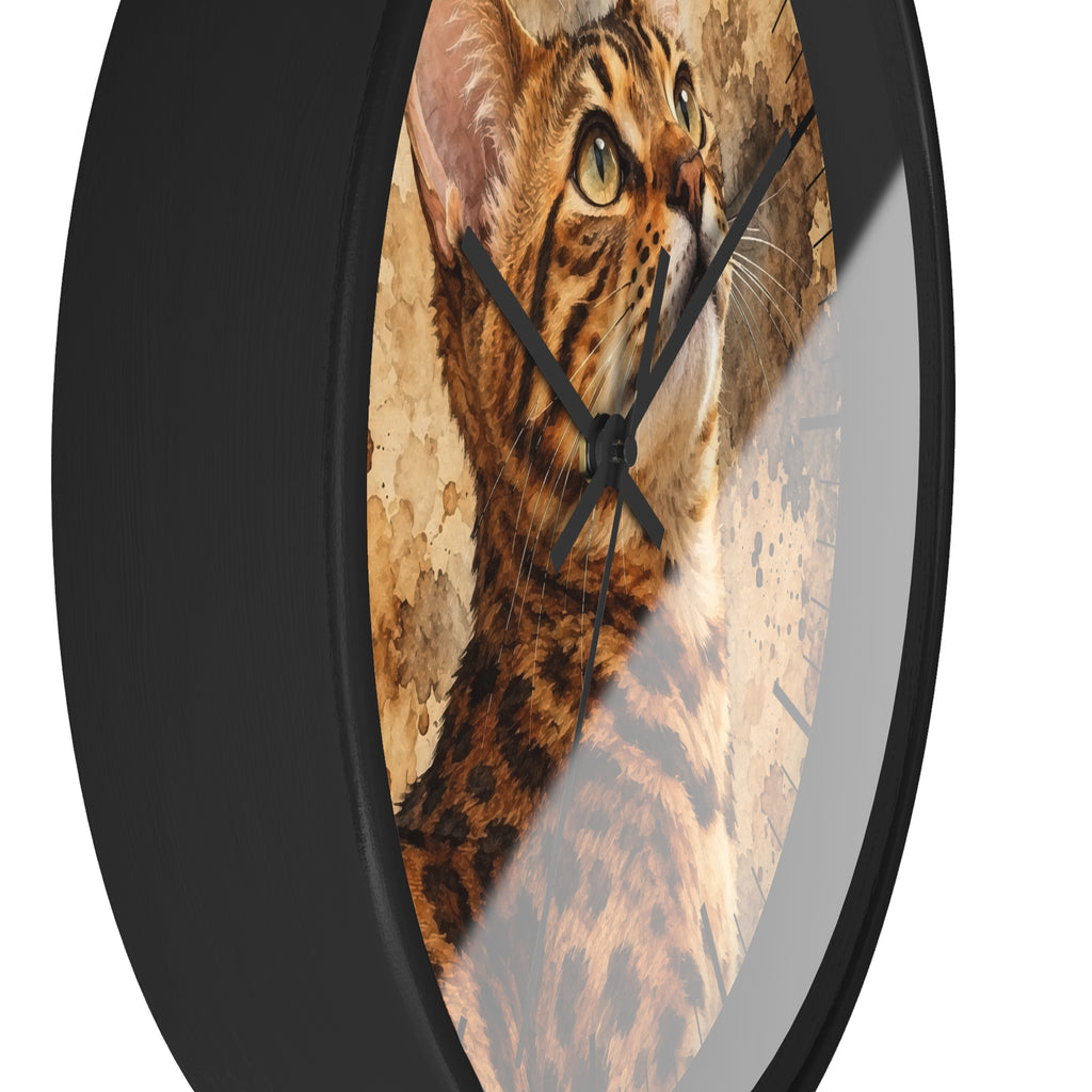 Round wall clock with a black frame and a printed cat face and fur pattern on the face, shown against a plain white background.