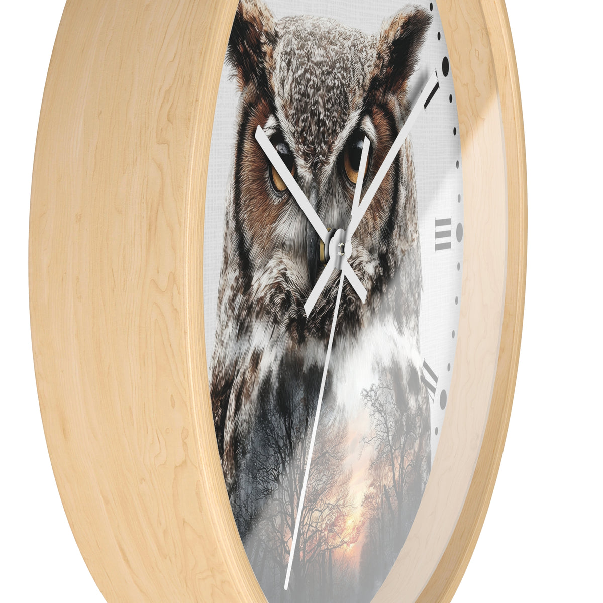 Round wall clock with a light natural wood frame and a printed owl face on the face, with white hands and black Roman numerals on a white background.