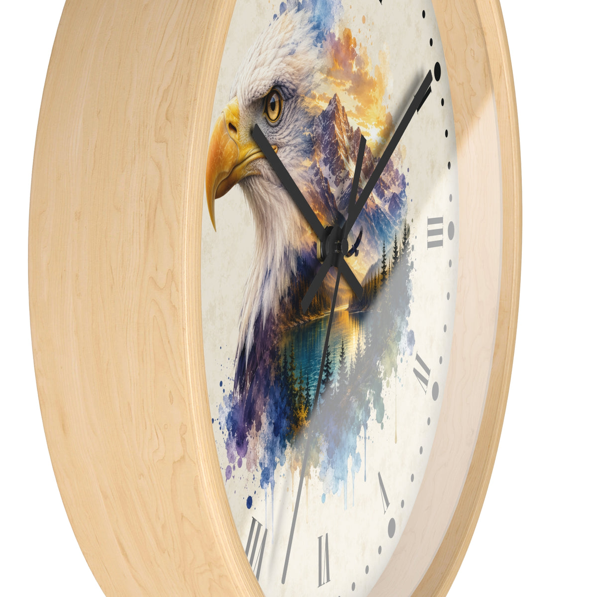 A round wall clock with a light natural wood frame and a white clock face featuring a watercolor-style bald eagle head with blue, purple, yellow, and orange painted details.
