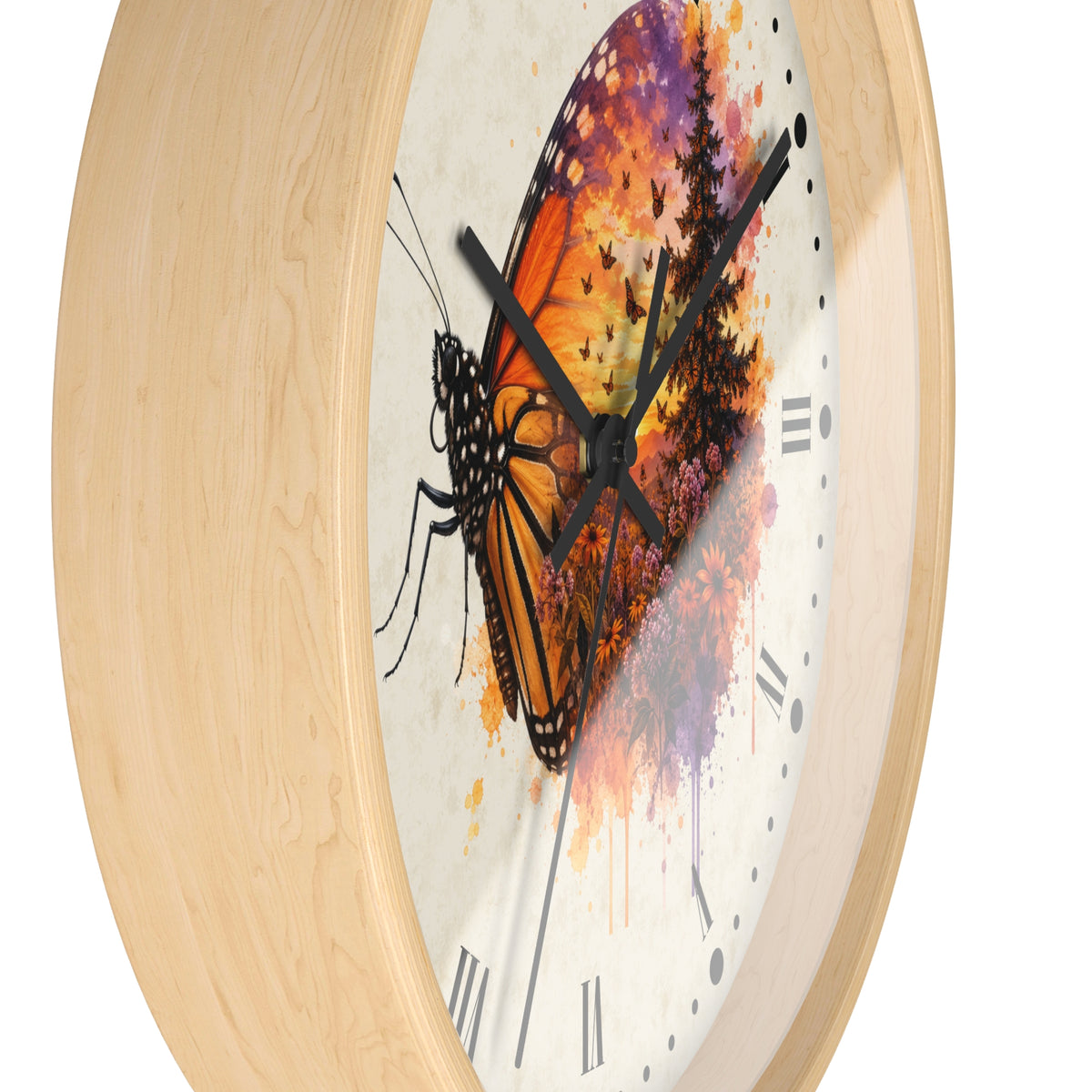 A close-up of a round wall clock with a light natural wood frame and a white dial featuring a large orange-and-black butterfly over a colorful watercolor sunset background.