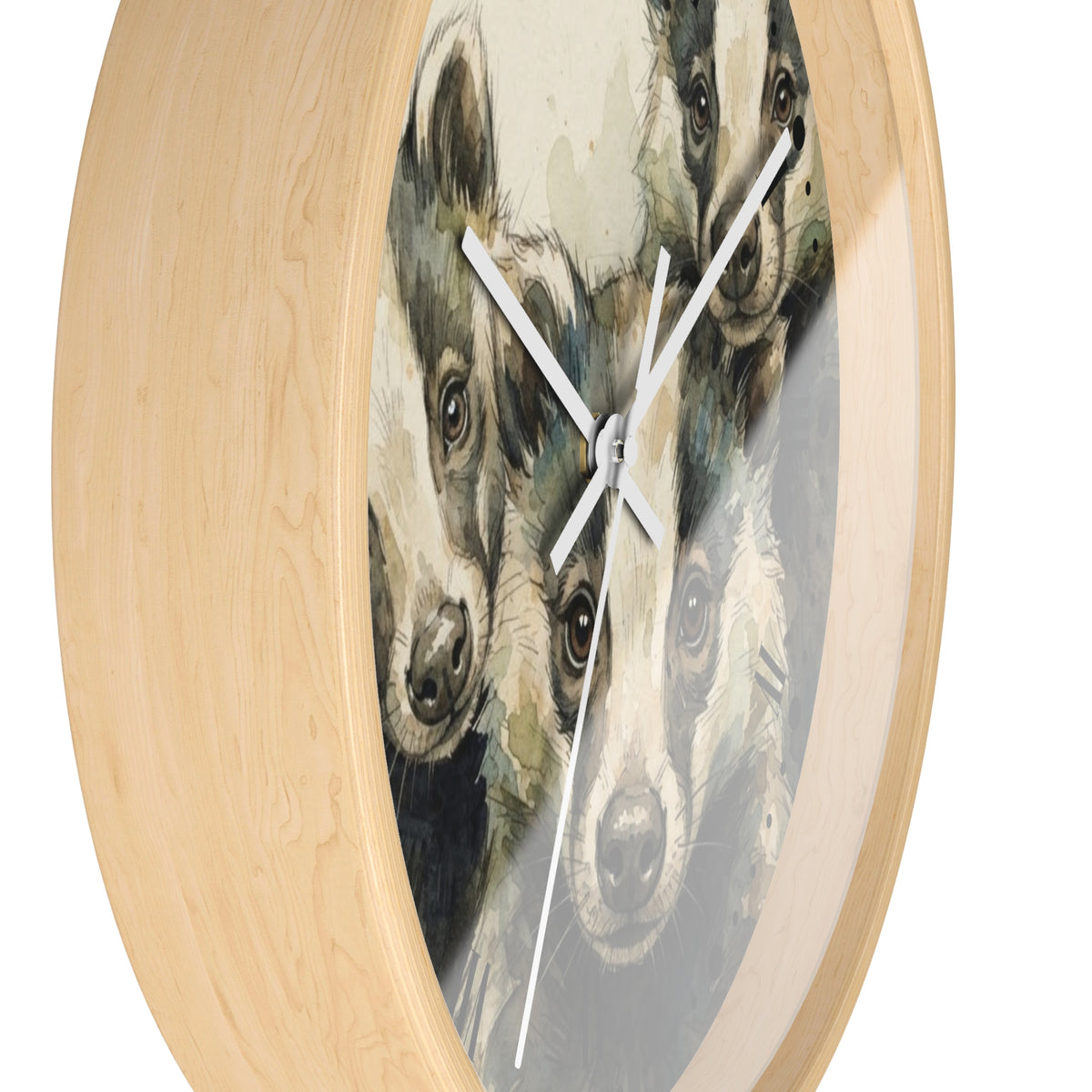 Round wall clock with a light natural wood frame and a printed face featuring three badgers in soft gray, brown, and beige tones. White clock hands are visible against a plain white background.