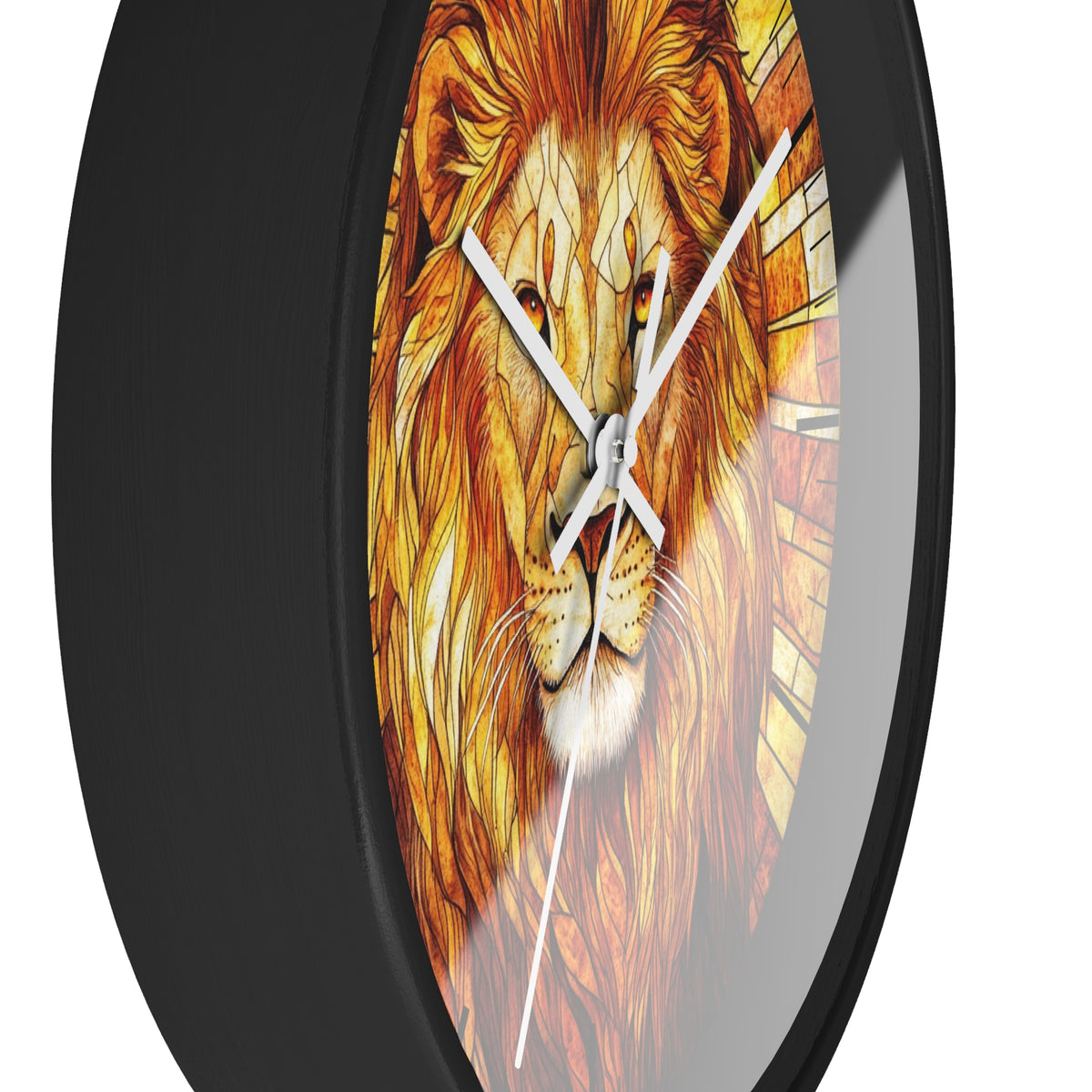 A round wall clock with a black frame and a printed lion face design in warm orange, yellow, and brown tones, with white clock hands on a white background.