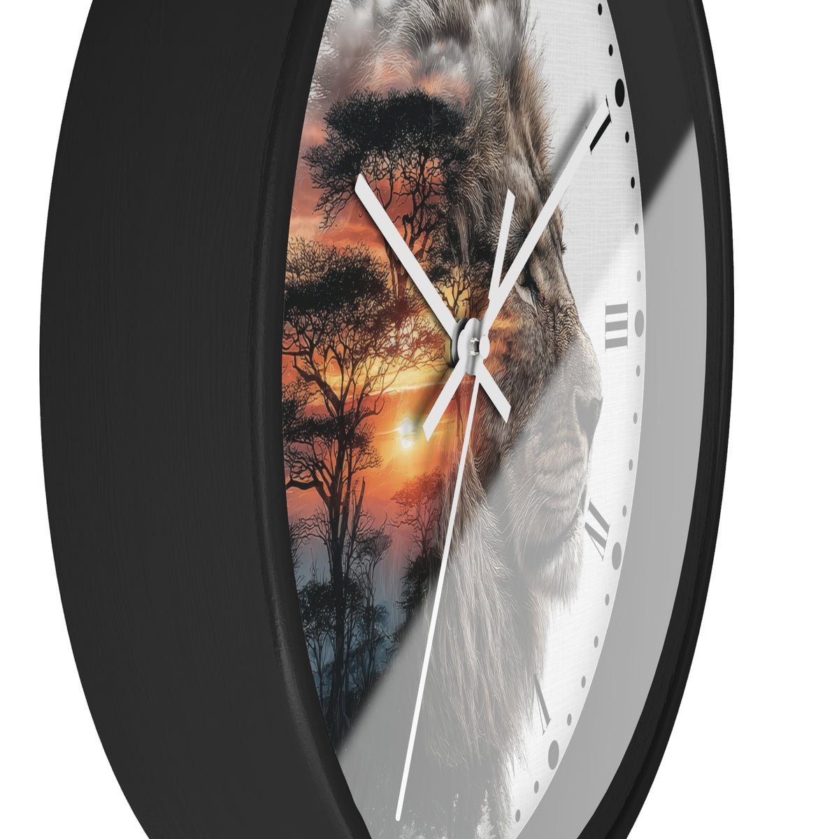 A close-up of a round wall clock with a black frame and a split design: one half shows a lion face, the other half shows an African savanna sunset with trees. The clock hands are white, and the background around the product is white.