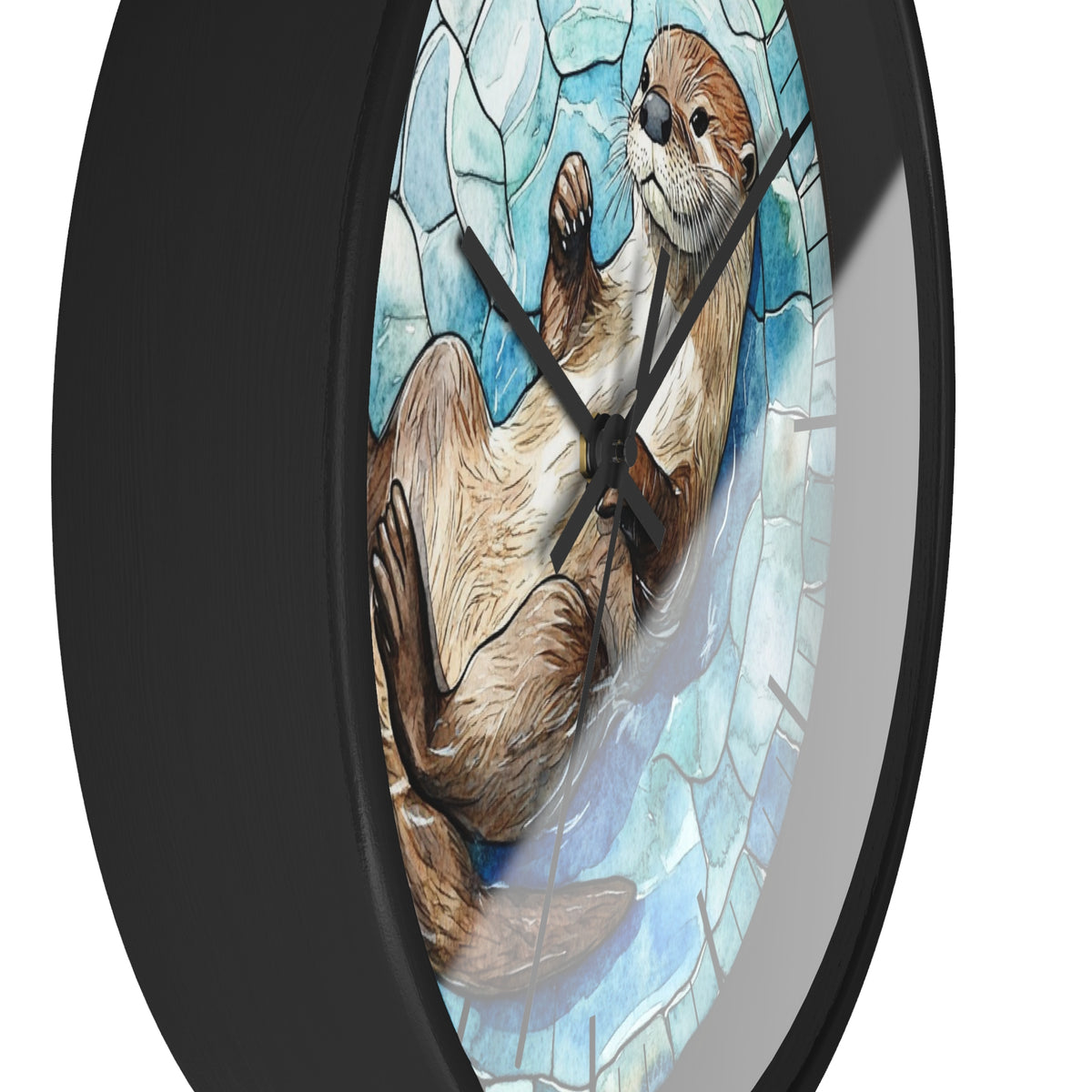 A round wall clock with a black frame and a stained-glass-style illustration of an otter on a light blue background, shown against a plain white backdrop.