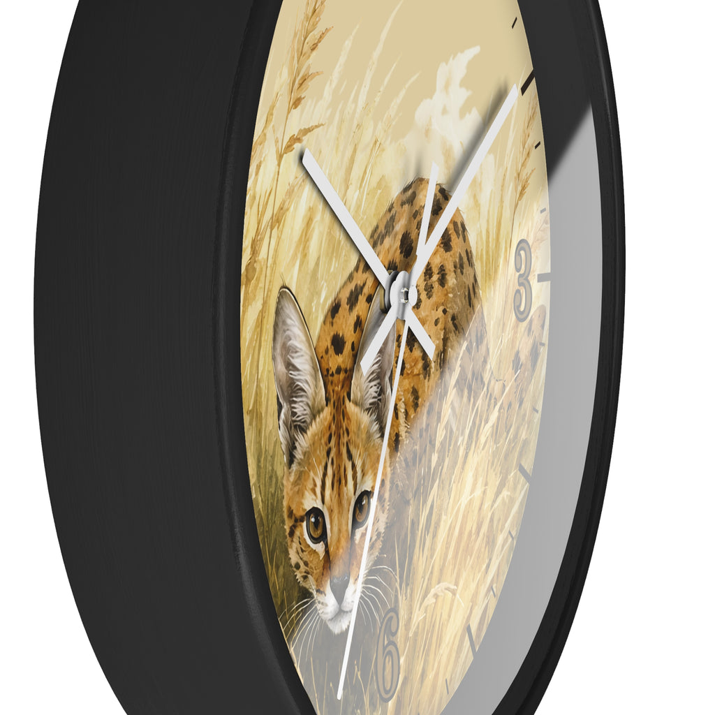 A round wall clock with a black frame and a printed face showing a spotted big cat in a field of tall grass. The clock is shown at an angle against a plain white background.