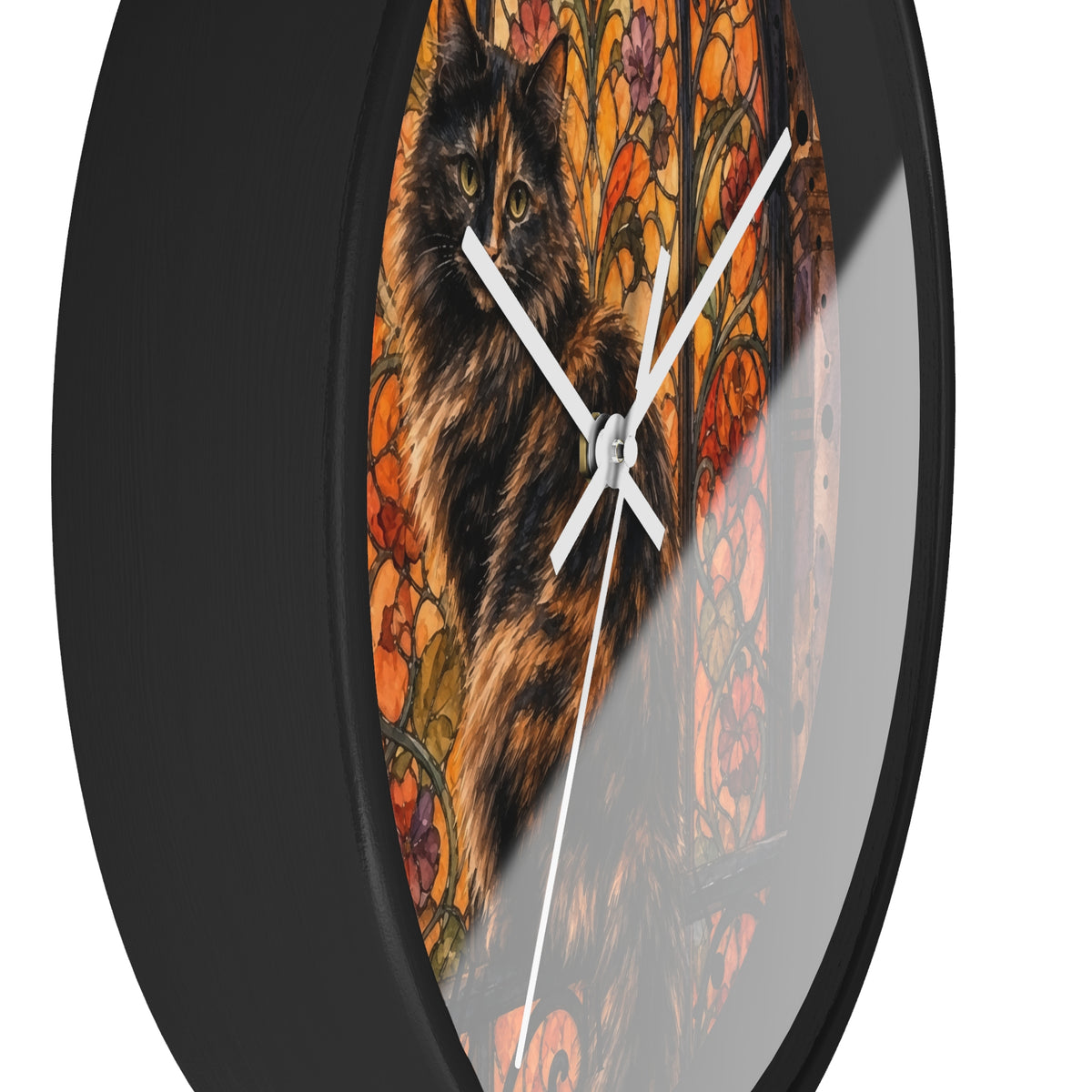 Round wall clock with a black frame and a printed design of a black cat in front of an orange floral stained-glass background, shown against a white background.
