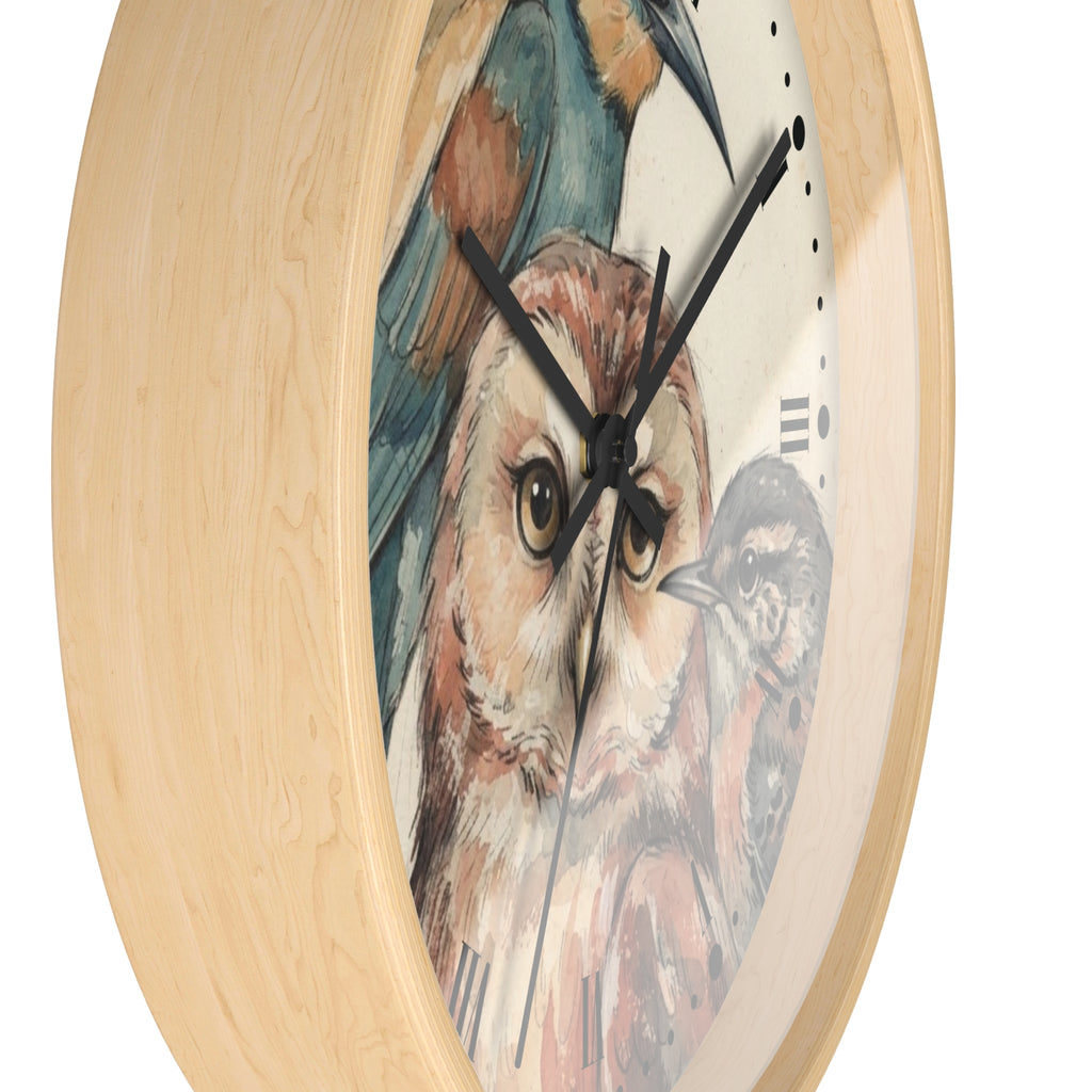 A round wall clock with a light natural wood frame and a printed bird illustration on the face, featuring a large owl in the center and black clock hands against a white background.