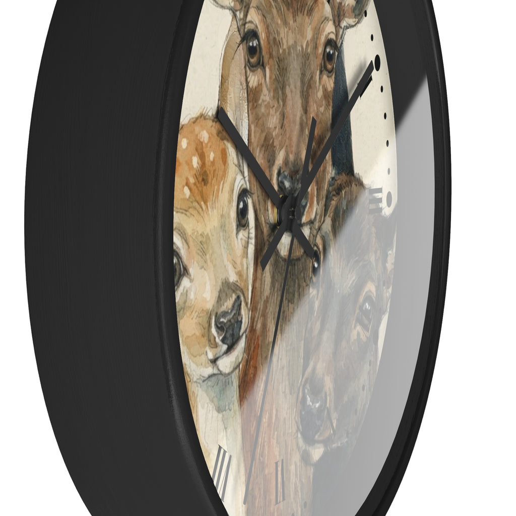 A round wall clock with a black frame and a printed animal face design featuring a deer, fawn, and bear on the clock face, shown against a plain white background.