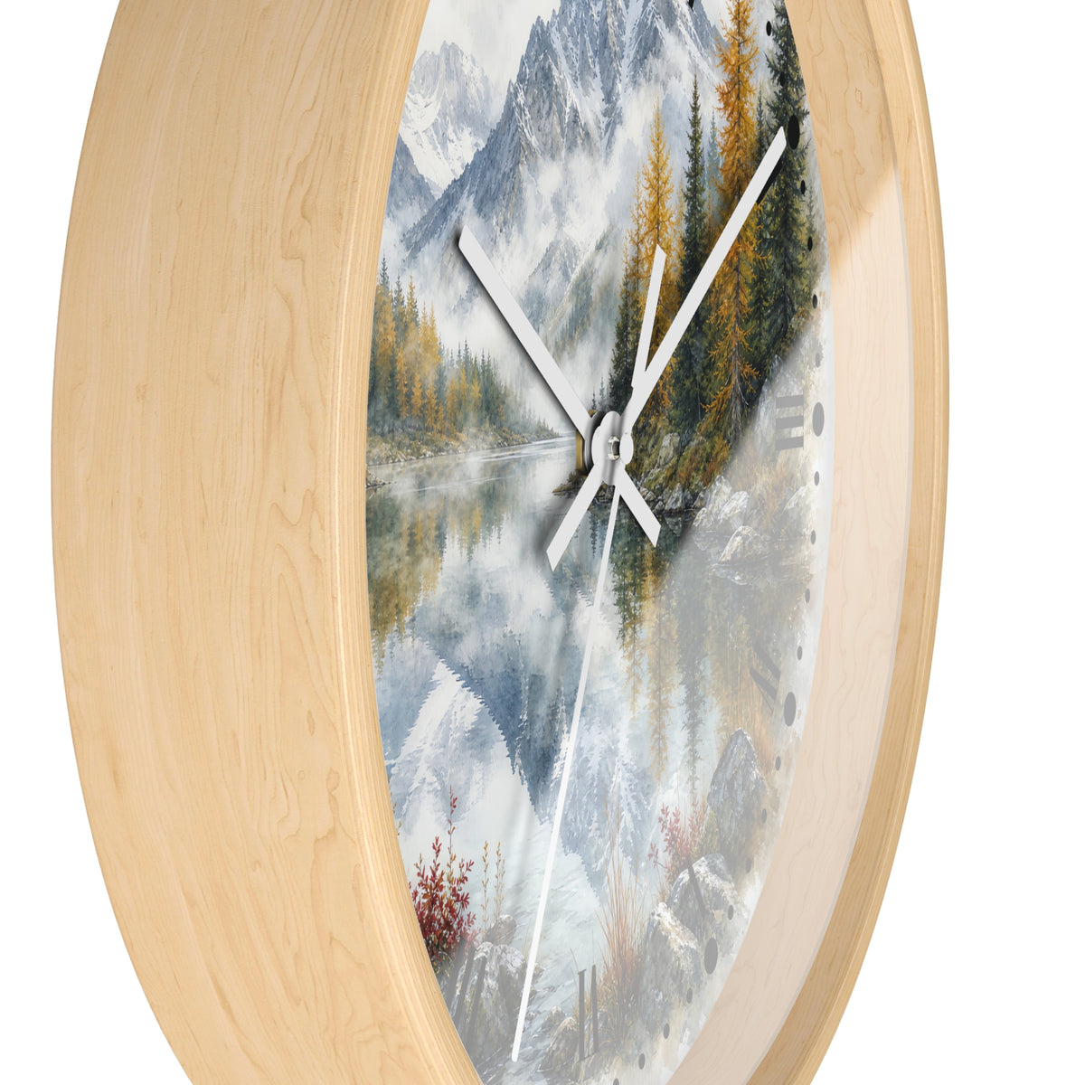 Round wall clock with a light natural wood frame and a scenic landscape print featuring mountains, a reflective lake, pine trees, and white clock hands.