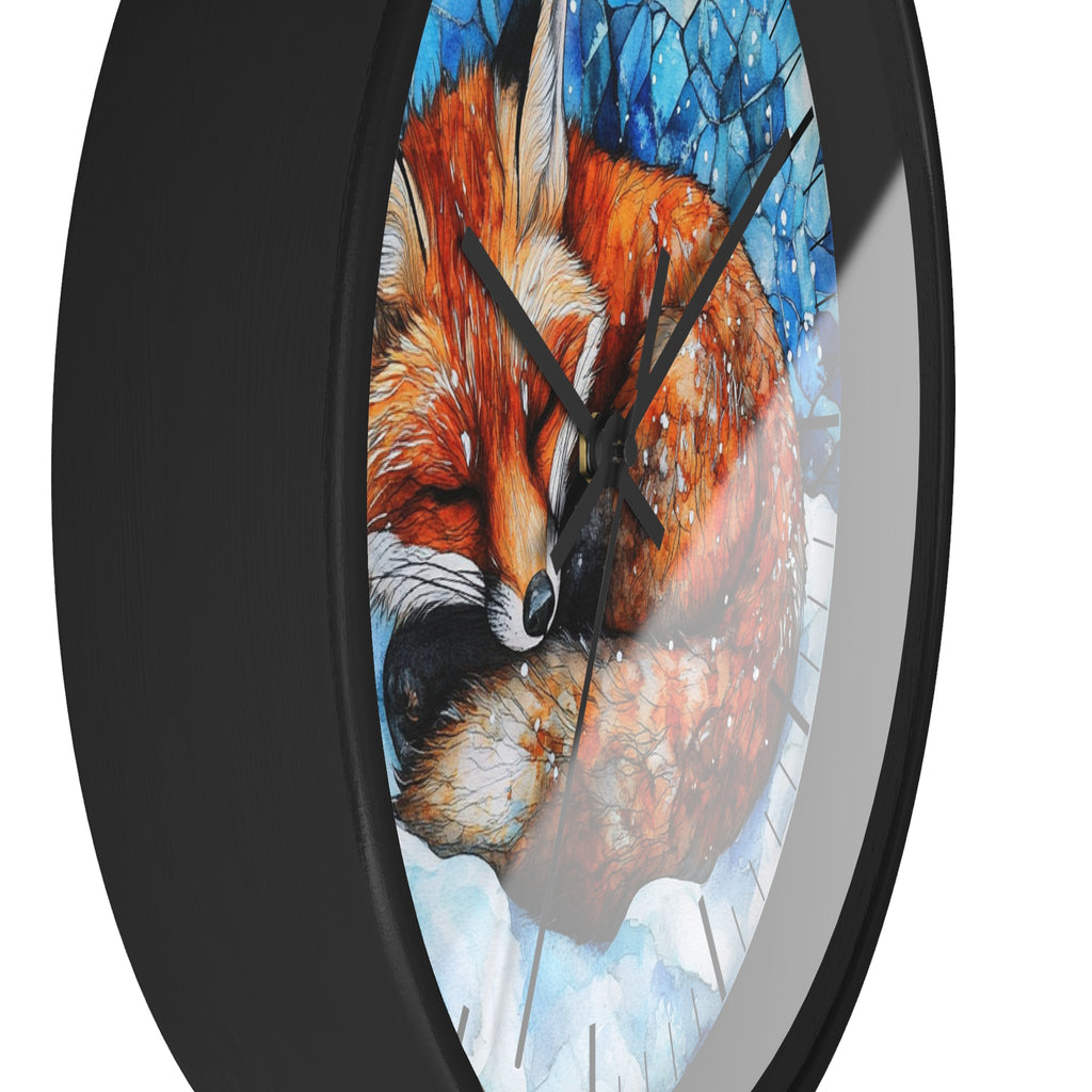 A close-up of a round wall clock with a black frame and a printed illustration of a sleeping fox in warm orange, brown, cream, and blue tones on the clock face.